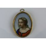 A Meissen oval porcelain miniature  of young girl with halo in gilt metal frame, 6.5cm by 5cm (NC)