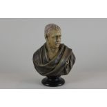 After A Bury, a ceramic bust of a Scotsman in tartan robe on circular base, reverse with impressed