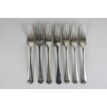 A set of seven George V silver Old English pattern silver dessert forks (maker's marks worn), London