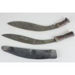 Two 19th century Gurkha kukri knives with wooden handles, largest with 34cm blade and scabbard (a/