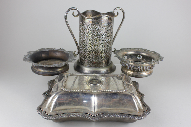 Two Victorian silver plated wine coasters on wooden bases, a rectangular entree dish with shaped