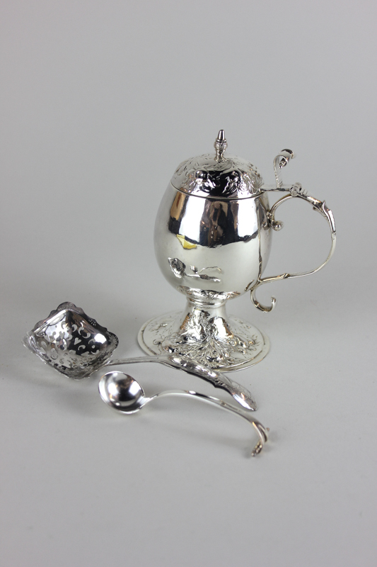 A Continental silver oval pot and matching spoon, with scroll handle and thumb piece, together