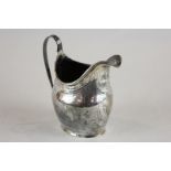 A George III silver cream jug, maker probably George Baskerville London 1800, with threaded rim