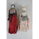 A 19th century glazed porcelain head doll with porcelain arms and legs, in cotton top and dress with