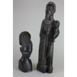 An African carved figure of a bearded man holding a child and staff, 52cm, and another carved wood