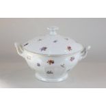 A German porcelain tureen and cover with hand painted floral motif and gilt enrichment, base stamped