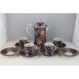 A Chinese porcelain part coffee set of coffee pot, four cups and five saucers, with floral