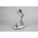 A Royal Dux, Art Deco style porcelain figure of a half nude snake charmer (a/f), 25cm high