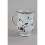 A Chinese porcelain tankard with butterfly and floral decoration (a/f), 14cm high