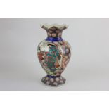 A Japanese satsuma vase, baluster shape with flared rim, depicting ladies in garden, 31cm high