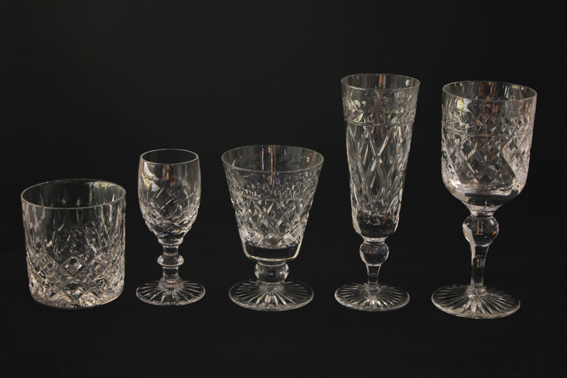 A set of six cut glass champagne flutes, six wine glasses and six aperitif glasses, together with