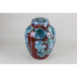 A Poole Pottery jar and cover in red and blue glaze, 31cm high