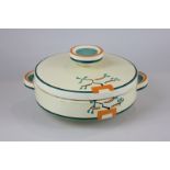 A Clarice Cliff Bizarre pottery tureen and cover, hand painted with a geometric design in green,