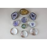 Seven glass paperweights together with three crystal filled stones, now as paperweights