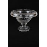A cut glass fruit bowl with incised floral decoration, an outwardly curved rim, on stand