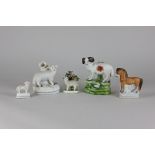 Five pieces of Staffordshire pottery, to include a ram, a sheep quill holder, two small sheep