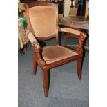 A mahogany framed elbow chair with upholstered back, seat and arms, open sides, lion's head arms and
