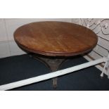 A circular pine dining table with tilt top on reeded column support and tripod base (no bolts) (a/