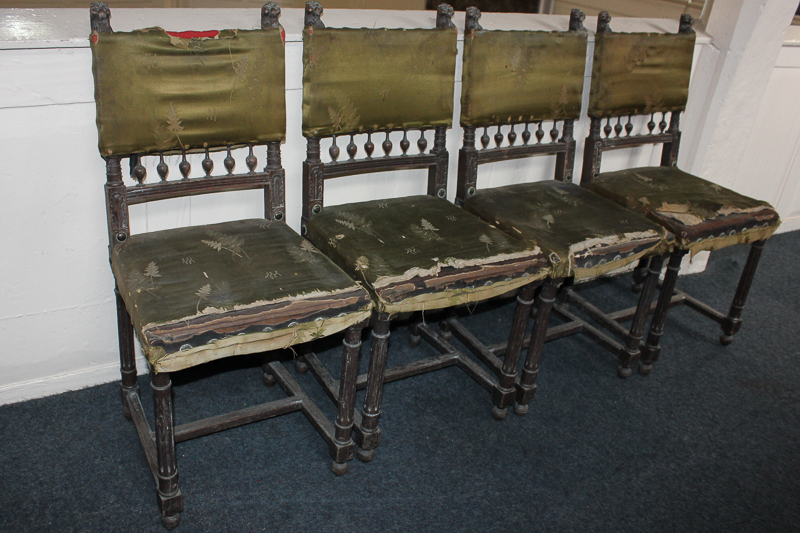 A set of four 19th century Cromwellian style dining chairs, lion crested supports above re-covered