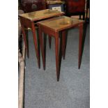 A nest of two occasional tables with inset tops on tapered legs (a/f)