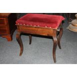 A mahogany framed music stool with red velvet upholstered lift-up seat, 51cm