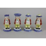 A 19th century willow pattern cruet of four pieces modelled as portly gentlemen, comprising a