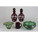 A pair of Bohemian ruby glass cut glass decanters, together with pearlescent green dish and vase and