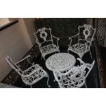 A set of four aluminium Victorian style garden chairs with worn painted white surface, floral