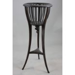 A mahogany jardiniere stand with slatted supports on three carved legs, 92cm high, (NC)
