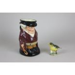 A Royal Doulton Toby jug of The Huntsman, together with a Beswick figure of a greenfinch