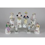 Four pairs of Staffordshire figures including fruit sellers, readers and husbands and wives, tallest