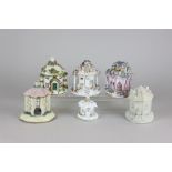 Five Staffordshire pastille burners modelled as round houses and a pearl ware pastille burner with a