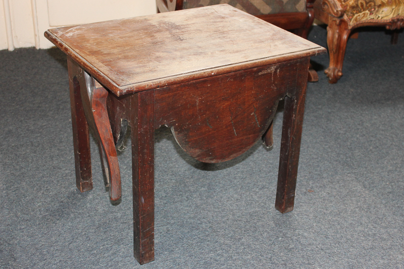 An early 20th century mahogany commode with lift-up flap top which becomes the back support, with