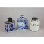 A 19th century enamelled tea caddy, together with a 19th century blue and white tea caddy finely