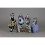 Six various porcelain figurines including a Nao girl with puppy, a Spanish Gama girl seated on