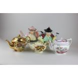 A collection of five early 20th century teapots including two portly gentlemen with split legs and