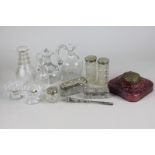 Five silver topped glass dressing table jars and a silver handled pair of tweezers, together with