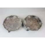 A pair of 19th century Sheffield silver plated circular salvers with embossed decoration, shell