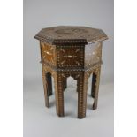 A Moorish occasional table with octagonal top inlaid in bone with floral designs, 38cm, (a/f -