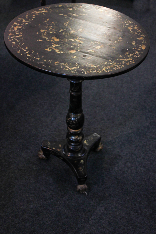 A Victorian papier mache circular occasional table with naturalistic gilt detail, on turned