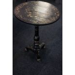 A Victorian papier mache circular occasional table with naturalistic gilt detail, on turned