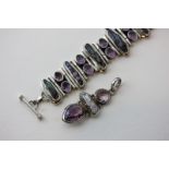 A silver bracelet set with Abalone shell and pale amethysts; and a matching pendant