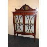 An Edwardian inlaid mahogany display cabinet with two oval jasper are plaques each in the centre