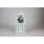 A 19th century Staffordshire pottery flat back model of a man in a pulpit, marked C H Spurgeon, in