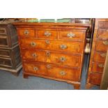 A Victorian walnut chest of drawers with three short drawers above three long drawers, on bracket
