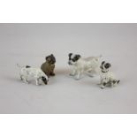 Four Austrian cold painted bronze dogs, three as black and white Jack Russells and a black and tan