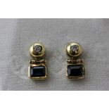 A pair of sapphire and diamond drop earrings in unmarked yellow gold