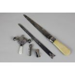 Two silver letter openers, a silver and mother of pearl baby's rattle, a silver clip and a silver