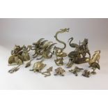 A collection of brass animal ornaments including figures on a camel, griffins (a/f), tortoise,