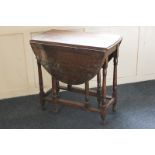 An oak drop-leaf table with oval top, on turned legs, 104cm (SPM)